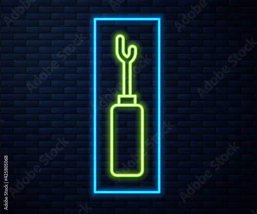 Glowing neon line Awl tool with wooden handle icon isolated on brick wall background. Work equipment tailor industry. Vector