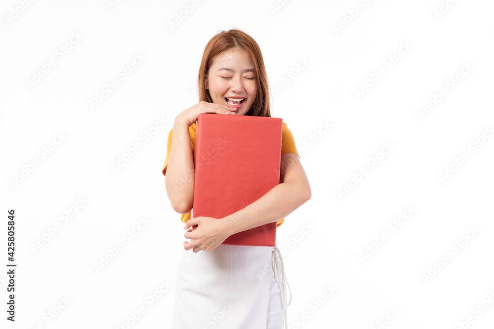 Asian women holding present box. Portrait of happy smiling Asian girl in casual clothing holding gift box isolated on white. Happy pretty Asian woman holding red gift box on white background. Asian women holding present box. Portrait of happy smiling Asian girl in casual clothing holding gift box isolated on white. Happy pretty Asian woman holding red gift box on white background.