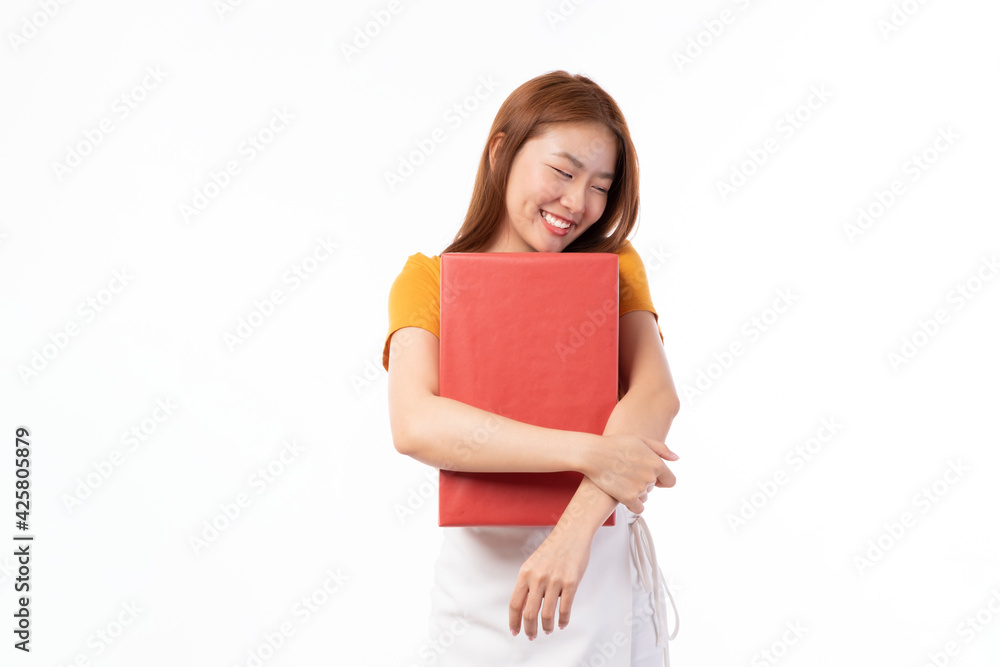Asian women holding present box. Portrait of happy smiling Asian girl in casual clothing holding gift box isolated on white. Happy pretty Asian woman holding red gift box on white background. Asian women holding present box. Portrait of happy smiling Asian girl in casual clothing holding gift box isolated on white. Happy pretty Asian woman holding red gift box on white background.