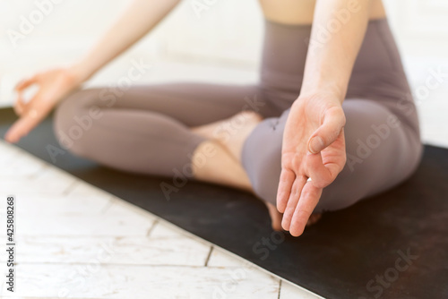 Wallpaper Mural Yogi woman practicing yoga lesson, meditating, doing Lotus pose with mudra gesture, close up. Well being, wellness concept Torontodigital.ca