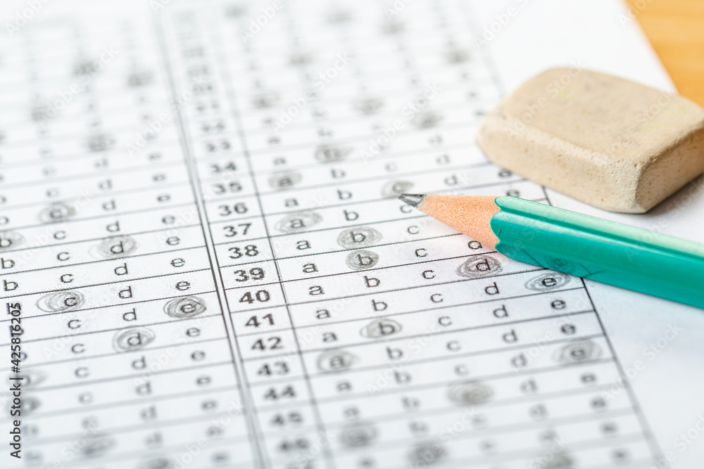 testing in exercise and exam paper. computer sheet with pencil in school test room, education concept. testing in exercise and exam paper. computer sheet with pencil in school test room, education concept.