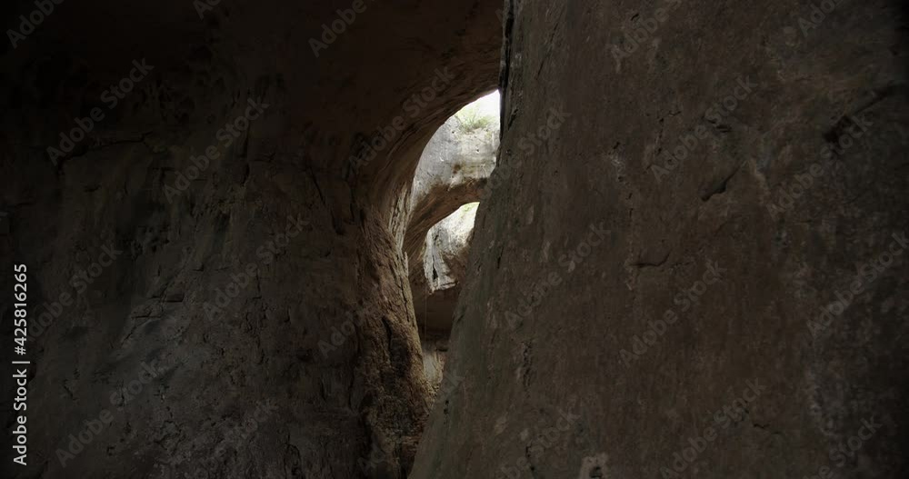 Prohodna cave in Bulgaria with two eye-like holes in its ceiling, known as the Eyes of God. 4k Prohodna cave in Bulgaria with two eye-like holes in its ceiling, known as the Eyes of God. 4k
