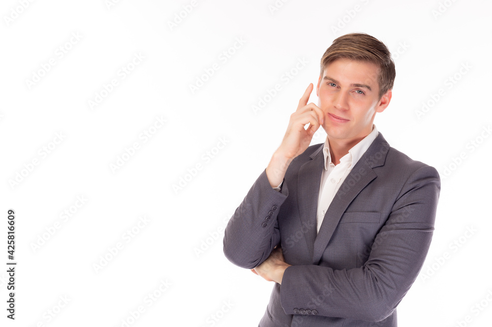 Young handsome business man in suit looking at camera thinking or dreaming Thoughtful businessman has a good idea Business executive guy with short hair, standing over isolated on white background Young handsome business man in suit looking at camera thinking or dreaming Thoughtful businessman has a good idea Business executive guy with short hair, standing over isolated on white background