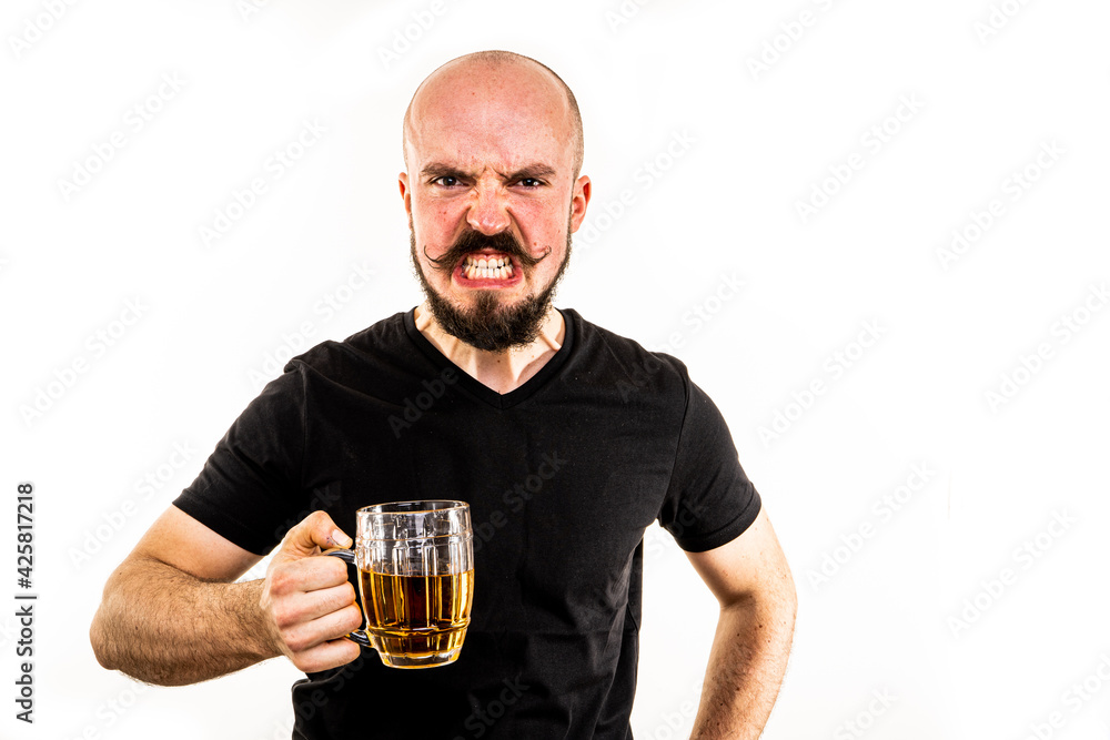 The man dressed in a black shirt poses in a photo studio. The man dressed in a black shirt poses in a photo studio.