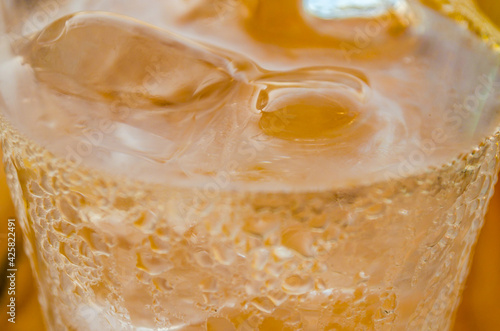 Close Up View of a Fresh Cold Soda Beverage in a Glass with Ice Cubes. Liquid Abstract Background. Macro Photography. Chania, Crete, Greece