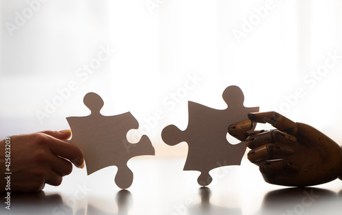 hands holding puzzle pieces. Game puzzle. Concept. 
