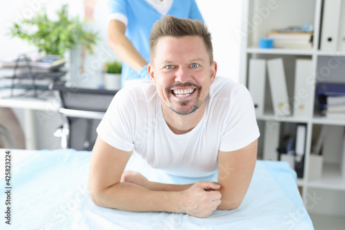Portrait of smiling man at proctologist appointment