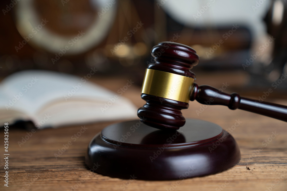 Law theme. Lawyers office. Gavel on the rustic brown desk. Law theme. Lawyers office. Gavel on the rustic brown desk.