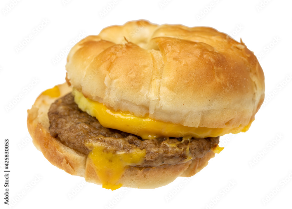 Side view of a croissant sausage egg and cheese breakfast sandwich Side view of a croissant sausage egg and cheese breakfast sandwich