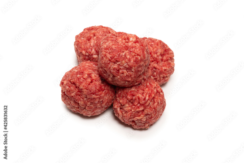 Raw meat balls isolated on white background.