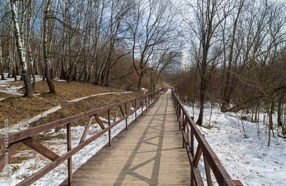 A footbridge at the bottom of a small ravine. A footbridge at the bottom of a small ravine.