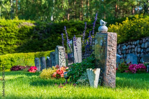 Fototapeta A row of gravestones at a well-cared cemetery in Sweden