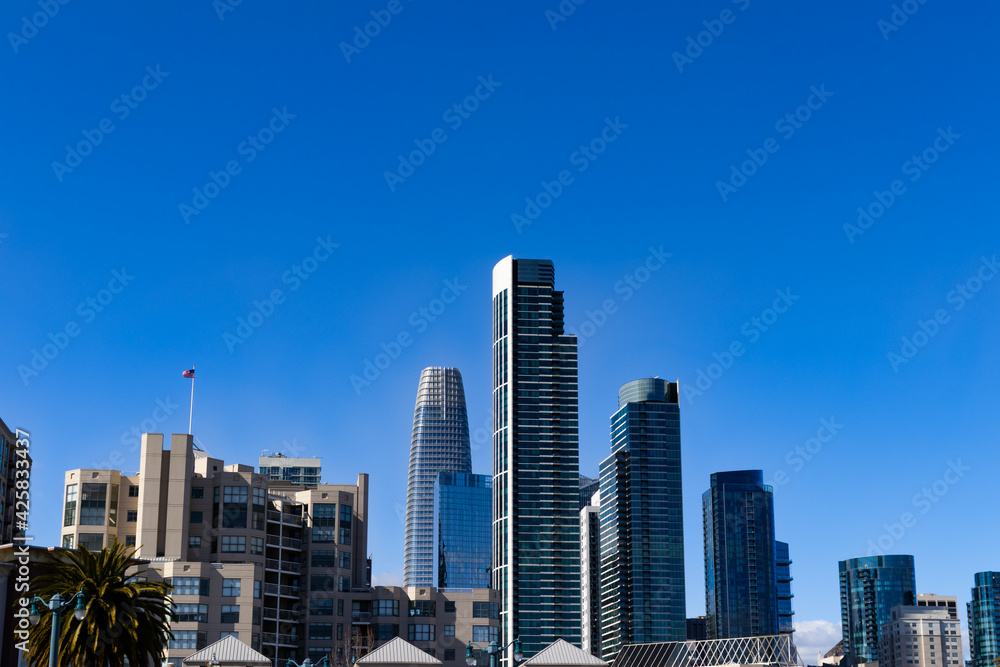 Dramatic San Francisco Bay Area California city skyline clear sky with skyscrapers Dramatic San Francisco Bay Area California city skyline clear sky with skyscrapers