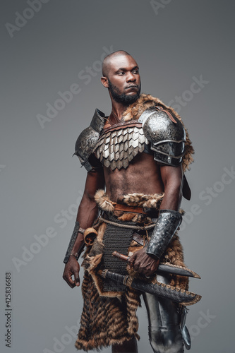 African fighter in viking style dressed in antique protective clothing