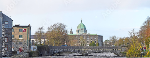 Views of the bridge over Corrid river with the Cathedral in the background in Galway, Ireland