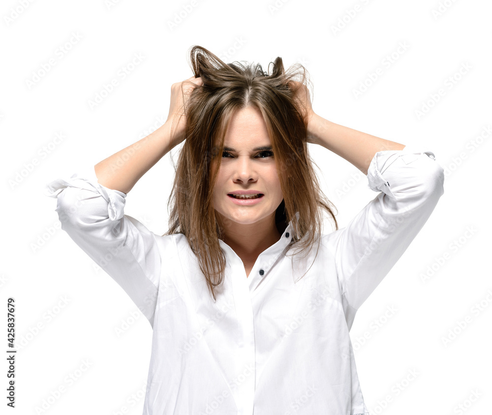 Angry woman rips her hair. Problems, headache, stress and depression concept Angry woman rips her hair. Problems, headache, stress and depression concept