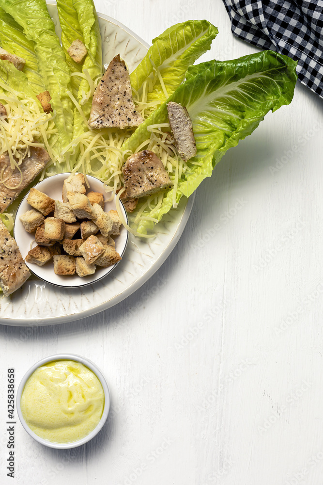 Homemade Caesar Salad with romanine, cheese, croutons, chicken, lemon and sauce Homemade Caesar Salad with romanine, cheese, croutons, chicken, lemon and sauce