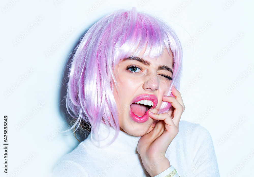 Young winking funny woman or cute sexy girl with pink glamour hair wig. Young winking funny woman or cute sexy girl with pink glamour hair wig.