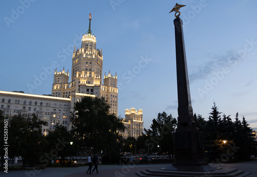 The so-called Stalin's skyscraper Kotelnicheskaya Embankment Building and Monument to the Frontier Guards of the Fatherland at the Ustinskaya embankment in Moscow photo