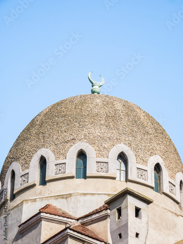 Close up with the dome and the crescent moon or Hilaal of Mosque of Constanta- Minaret, located in Constanta Romania. photo