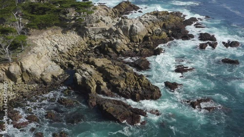 Backwards Aerial Pan Big Sur Rocky Coastline in California
