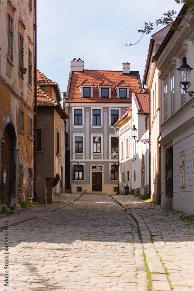 Bratislava in the spring of 2020. Street in the historical center of the city. Old houses with tiled roofs.