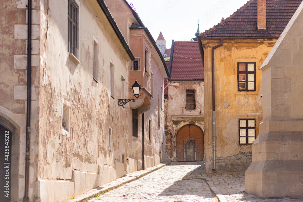 Bratislava in the spring of 2020. Street in the historical center of the city. Old houses with tiled roofs.