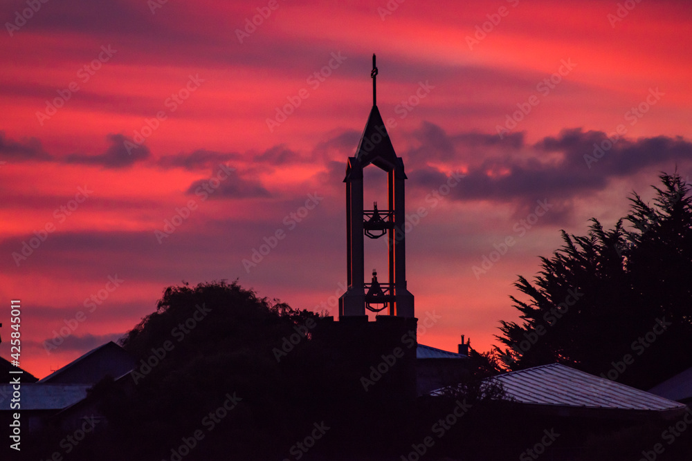 Sunrise time pink sky view to church with bells in Ancud, Chile Sunrise time pink sky view to church with bells in Ancud, Chile