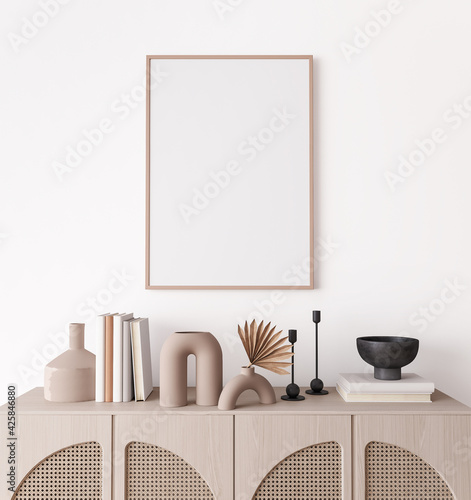 Poster frame mock up in living room interior, modern furniture and wooden decorative rattan cabinet with trendy home accessories, 3d render