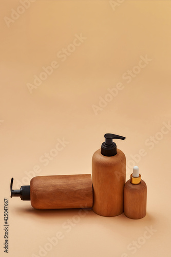 Set of wooden containers of different sizes isolated on beige background. Zero waste and eco conscious life