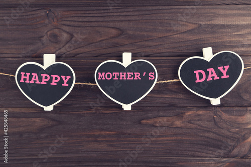 Text Happy Mother's Day on blackboards in shape of hearts