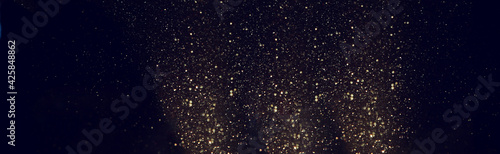 background of abstract gold and black glitter lights. defocused © tomertu