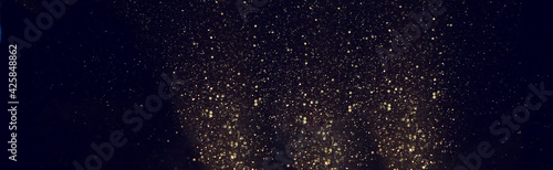 background of abstract gold and black glitter lights. defocused