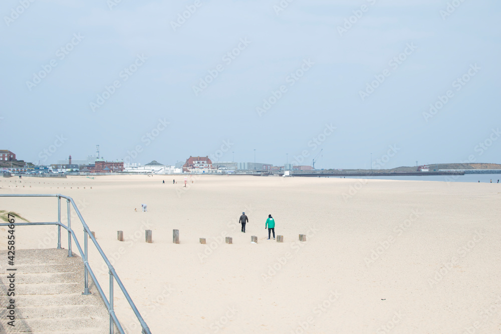 Gorleston beach in Norfolk, with views of Cliff Hotel and promenade.