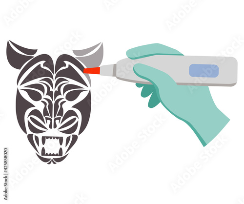 Laser tattoo removal tiger face.Removal procedure unwanted tattoos.Laser surgery.Hand holds tattoo removal machine tattoo.