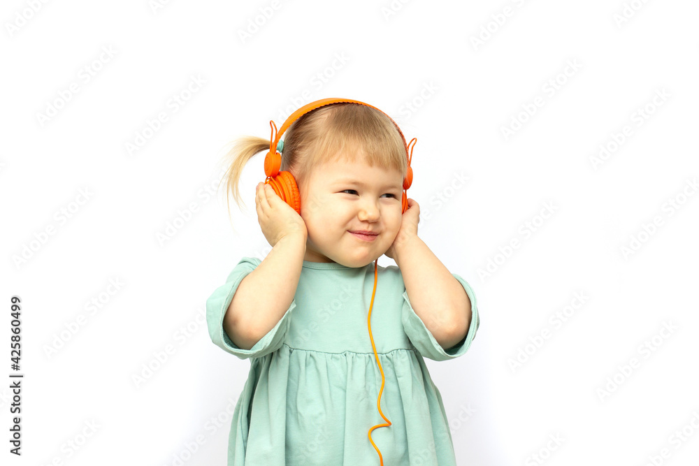 people, children and technology concept - smiling girl with headphones listening to music people, children and technology concept - smiling girl with headphones listening to music