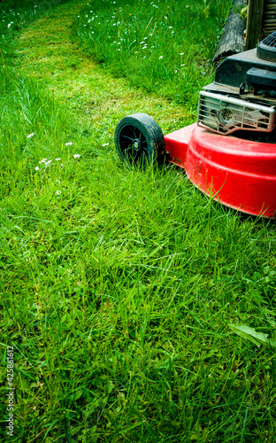 Plakat lawnmower on grass
