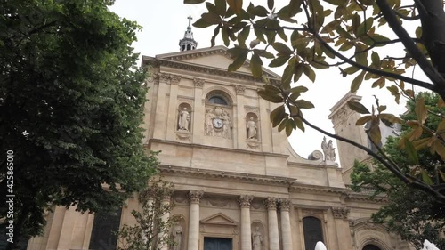 Sorbonne University with columns statues and clock in Paris photo