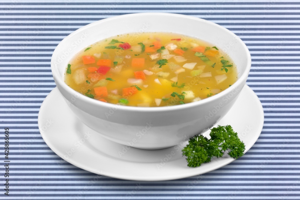 Bowl of delicious vegetable soup on a table