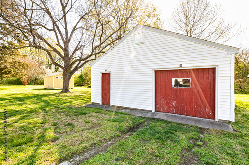 White Barn Shed with Red Door