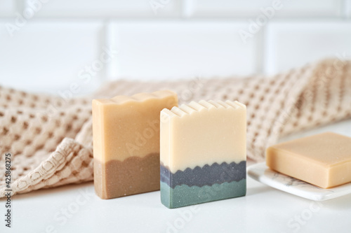 Organic handmade soap with natural ingredients and natural muslin towel. Spa at your home. Front view.