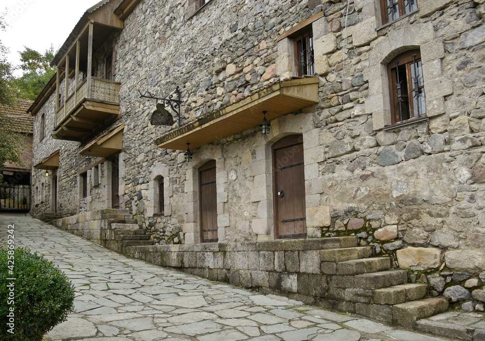 Traditional stone and wooden buildings, now used as shops, eateries, and a hotel, in the Dilijan Historic Centre (Shaambeyan Poghots), Dilijan, Armenia