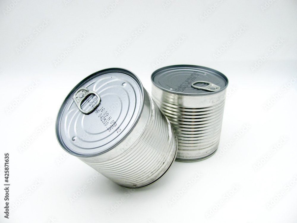 Two closed tin cans on a white background. Two closed tin cans on a white background.