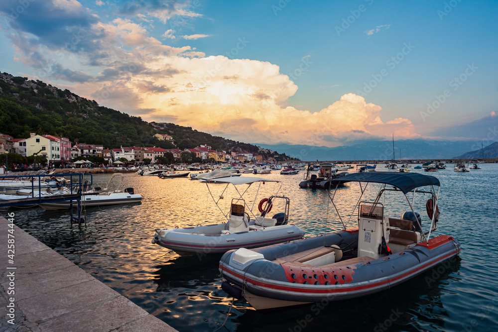Moored Boats at sunset in the Baska town