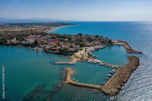 Fototapeta Naklejka Na Ścianę i Meble -  Aerial View Of Side Antique City . Side Old Town amphitheater. Side Harbor marina in Antalya Turkey drone view