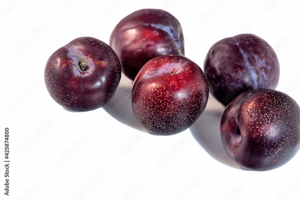 Large red ripe organic plum on an isolated white background. 