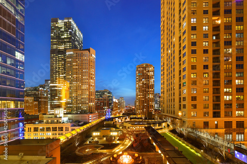 Chicago skyline after sunset showing Chicago downtown with car tail lights. Chicago, on Lake Michigan in Illinois, is among the largest cities in the U.S.  photo