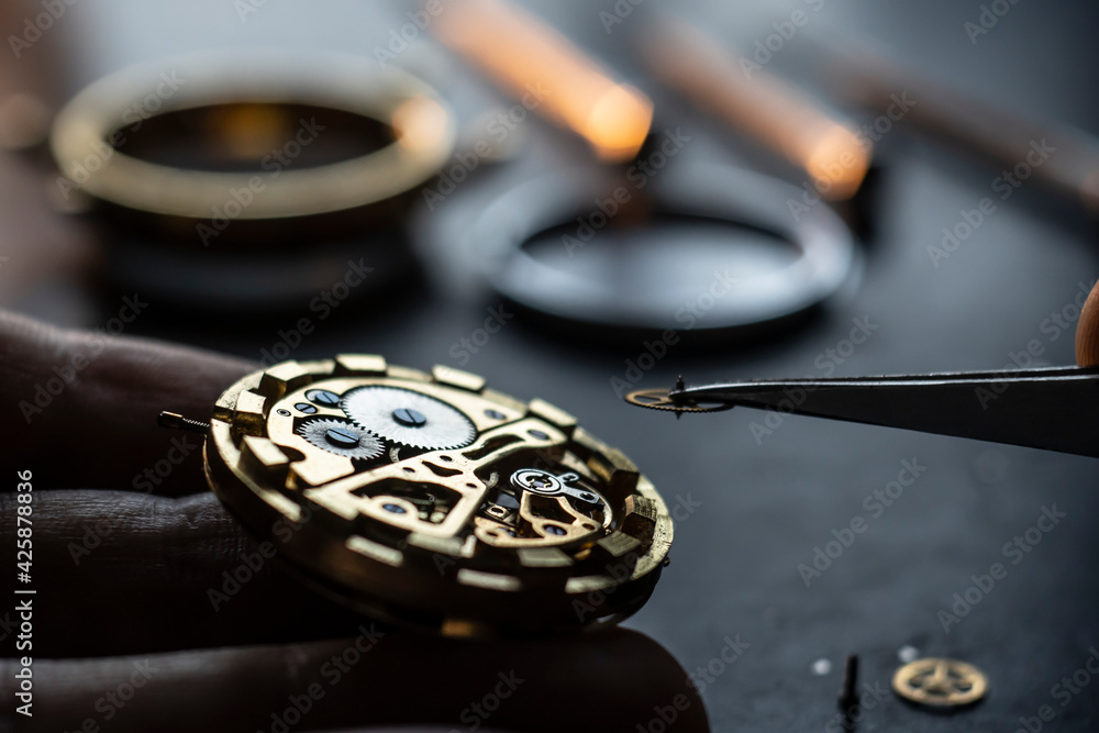 Mechanical watch repair process. Open pocket wristwatch. vel