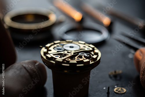 Mechanical watch repair process. Open pocket wristwatch. vel