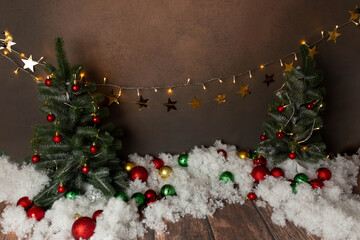 background texture. the deck is made of wood adorned with Christmas decorations. basket for newborn photo shoot. Christmas tree and toys